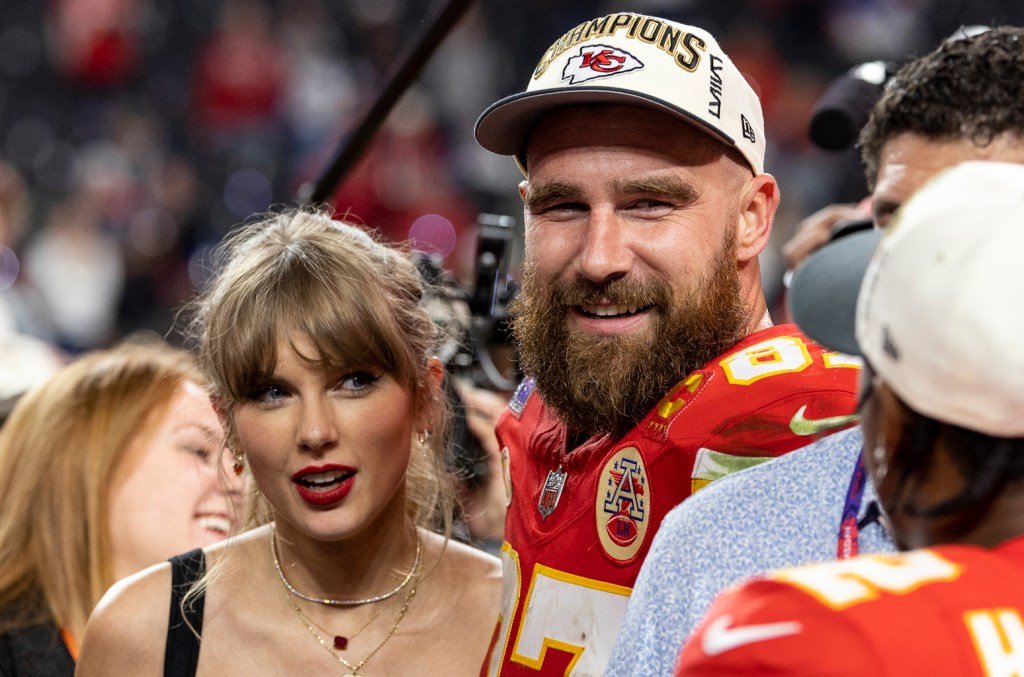 Travis Kelce #87 of the Kansas City Chiefs and Taylor Swift react as they see Mecole Hardman Jr. ...