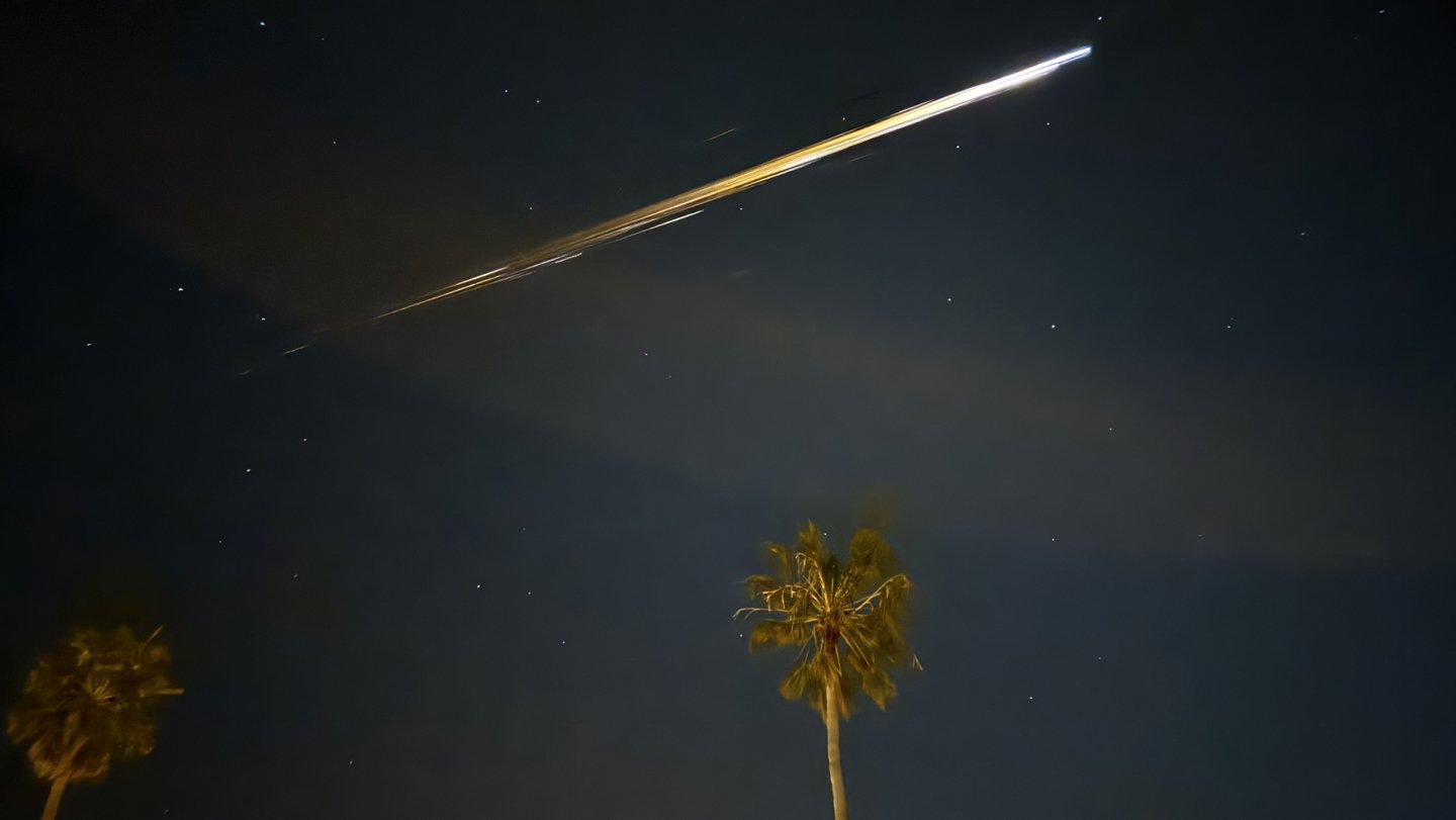 Space junk streaks through the sky over Ventura, Calif., on April 2, 2024, as falling bits of a C...