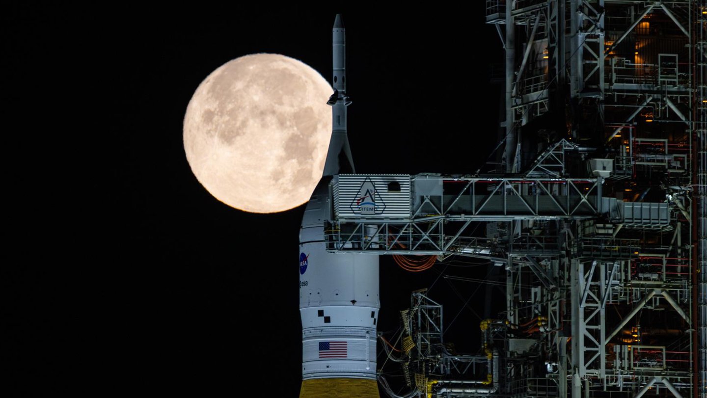 NASA’s Space Launch System rocket sits in front of a full moon on February 1. The rocket is at ...