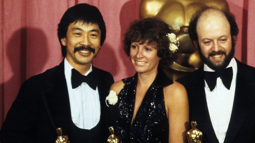 Richard Chew, left, Marcia Lucas and Paul Hirsch accept the Oscar at the 50th Academy Awards in 1...