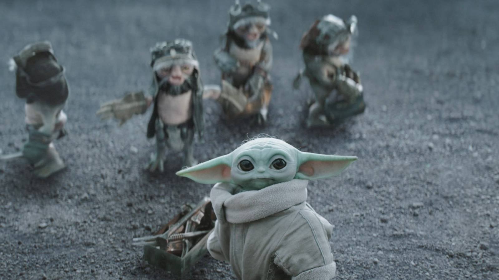 Grogu standing in front of a group of anzellans in The Mandalorian and Grogu