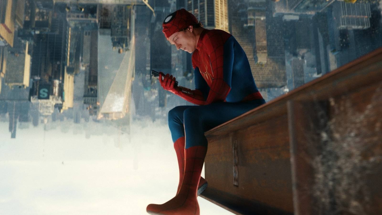 Tom Holland As Spider-Man Sitting On The Underside Of A Beam Over NYC In Spider-Man Brand New Day