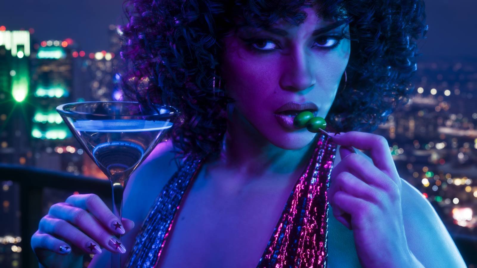 A close-up on Lucia holding a full martini glass and eating the olive garnish off a skewer.