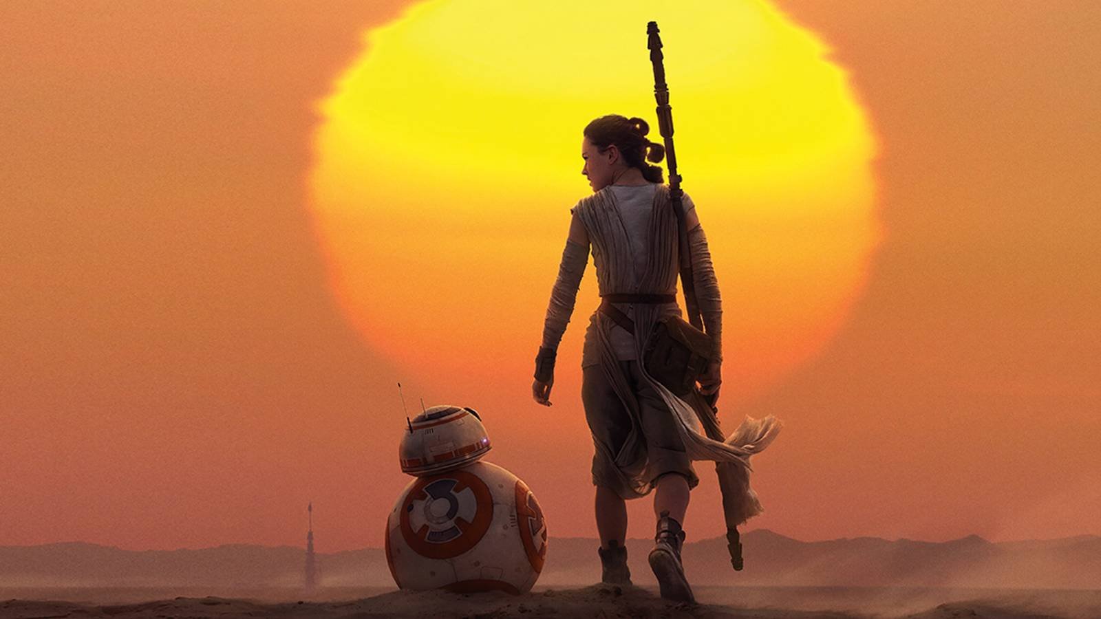 Rey and BB-8 standing in front of a sun in Star Wars The Force Awakens