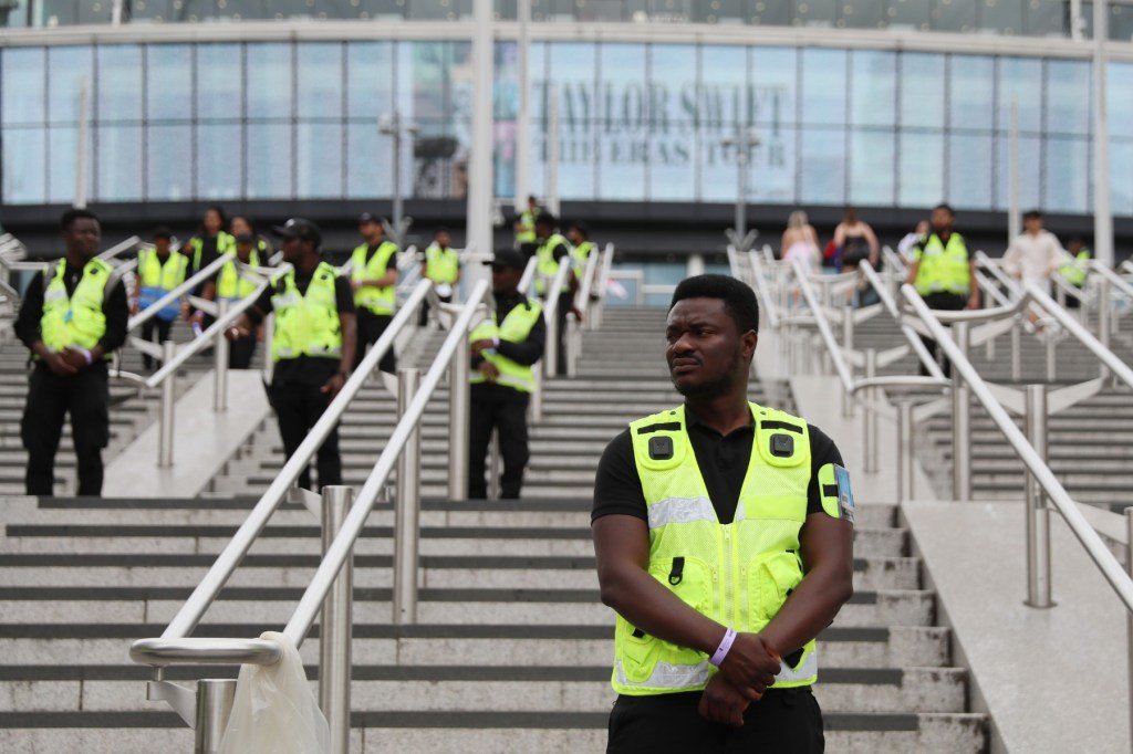 A member of security stands outside the stadium before the Taylor Swift Eras Tour five night resi...