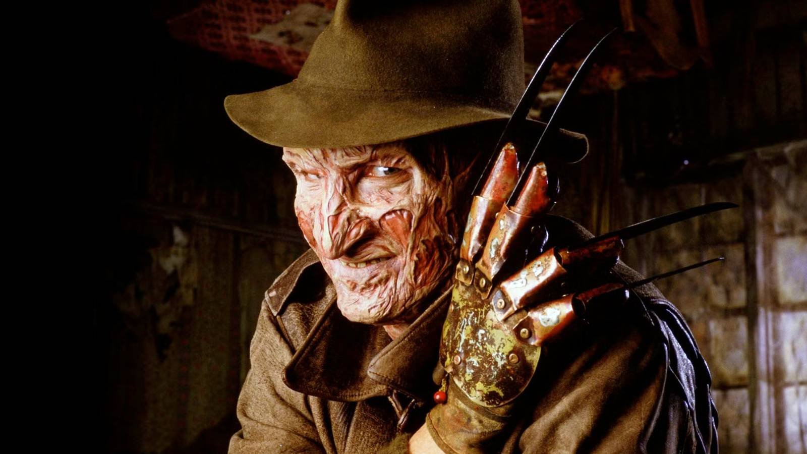 Robert Englund as Freddy Krueger with his claw and hat in A Nightmare on Elm Street