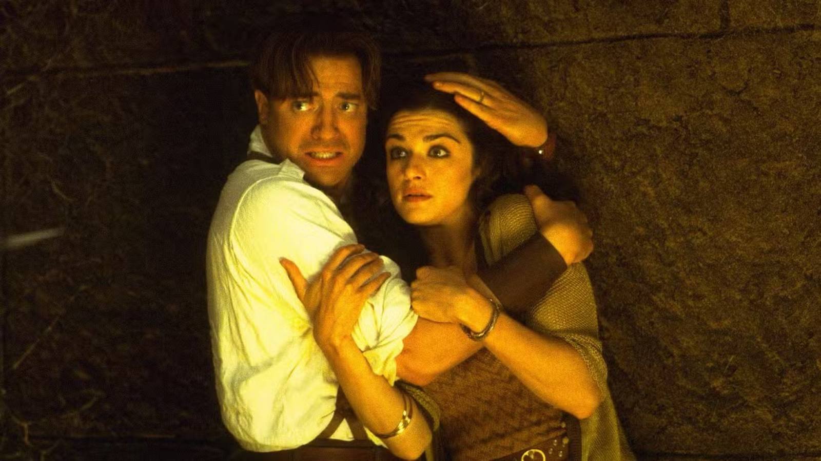 Brenda Fraser and Rachel Weisz as Rick and Evelyn, hugging in The Mummy