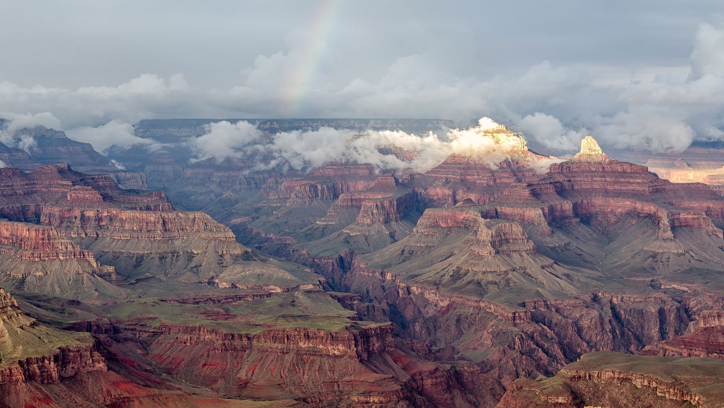 A rainbow arcs over this view of the Grand Canyon from Hopi Point. A new study proposes that the ...