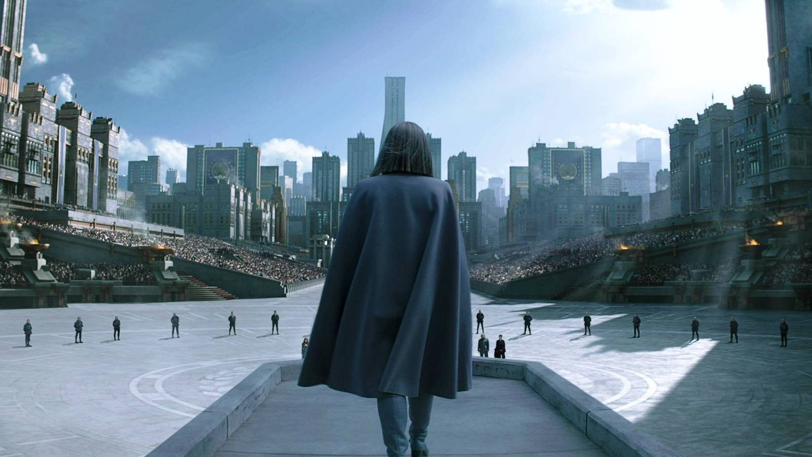 Coin standing before Panem in The Hunger Games: Mockingjay - Part 2
