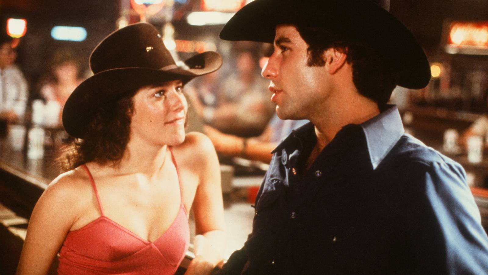 Urban Cowboy's John Travolta as Bud and Davis Debra as Winger Sissy