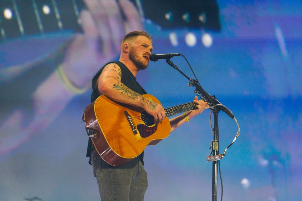 Zach Bryan performs during his concert at Gillette Stadium in Foxborough, Mass., on June 26, 2024...