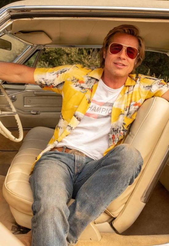 Cliff Booth poses in a car in Once Upon a Time... in Hollywood