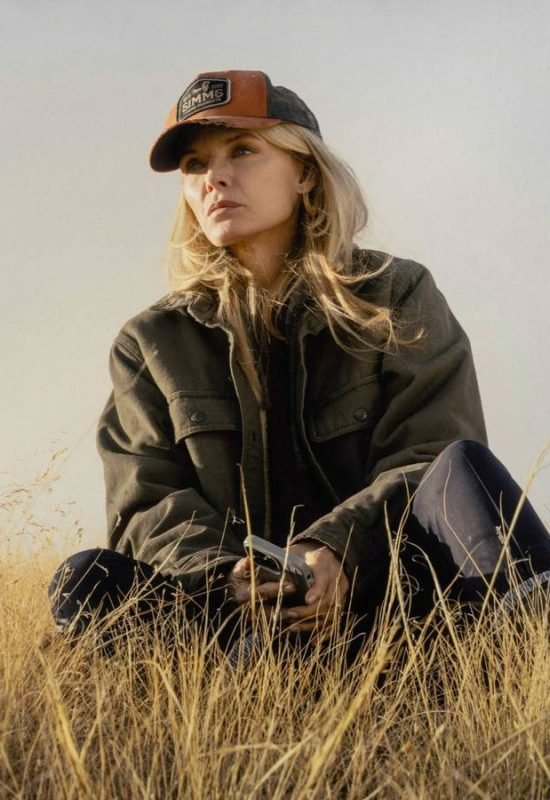 Stacy Clyburn (Michelle Pfeiffer) sitting in the grass in The Madison